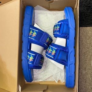 Size 12 blue Ksppa slides